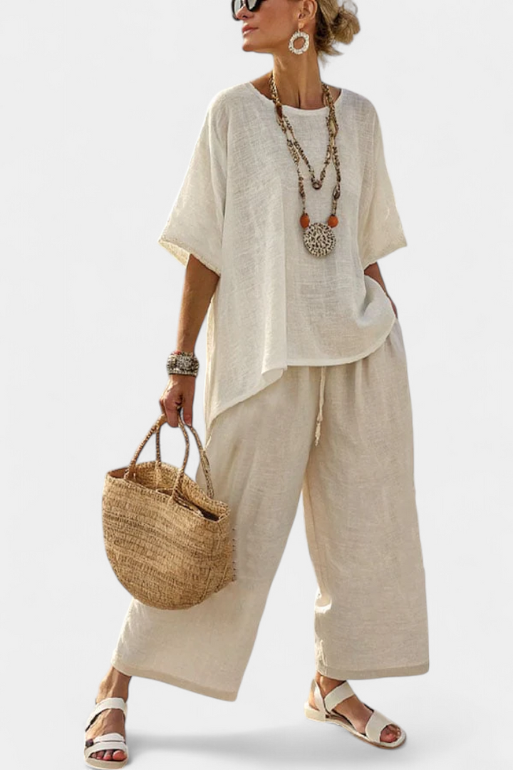 Conjunto feminino de linho para o verão com blusa oversize minimalista e calças de pernas largas.
